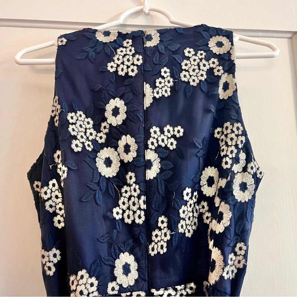 Tahari Elegant Sleeveless Dress with White Floral Embroidery over Deep Blue - Picture 6 of 14